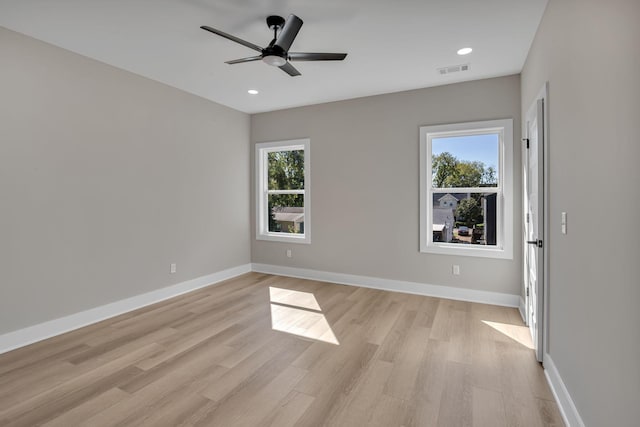 spare room with ceiling fan and light hardwood / wood-style flooring