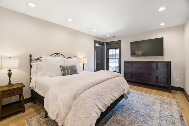 bedroom with light hardwood / wood-style flooring