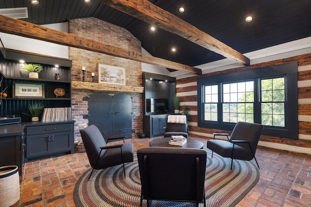 living room with lofted ceiling with beams