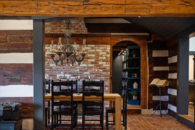 dining area featuring a notable chandelier