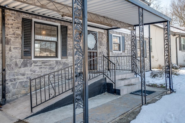 view of snow covered property entrance