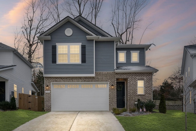 view of front property with a garage and a yard