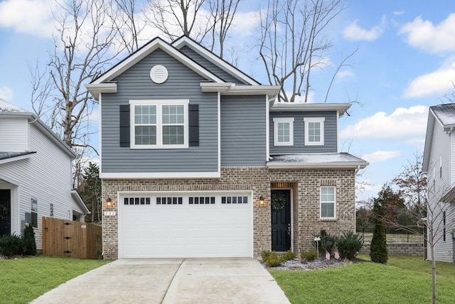 view of front of house featuring a front yard and a garage