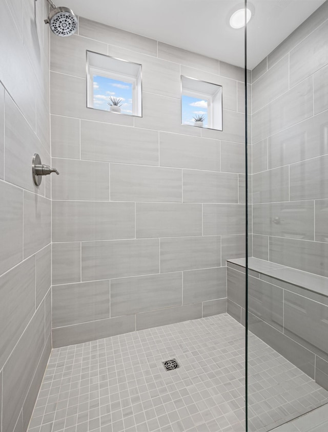 bathroom featuring tiled shower