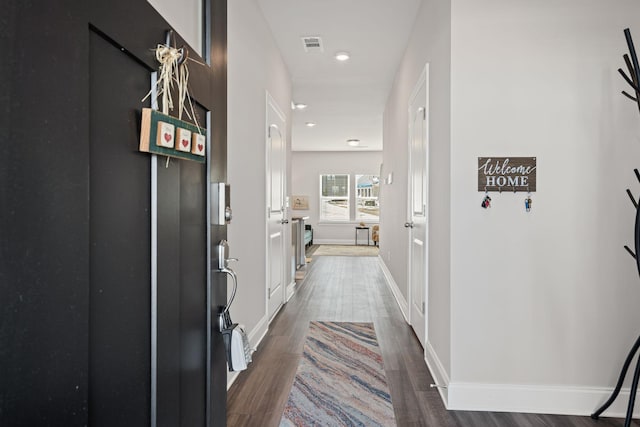 hall featuring dark wood-type flooring