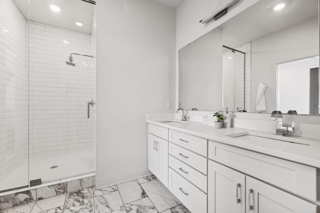 bathroom with vanity and a shower with shower door