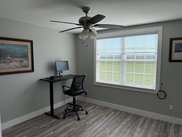 office area featuring baseboards and a healthy amount of sunlight