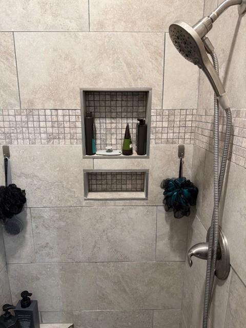 room details with a tile shower