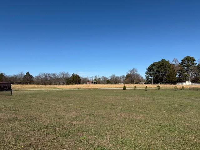 view of yard with a rural view