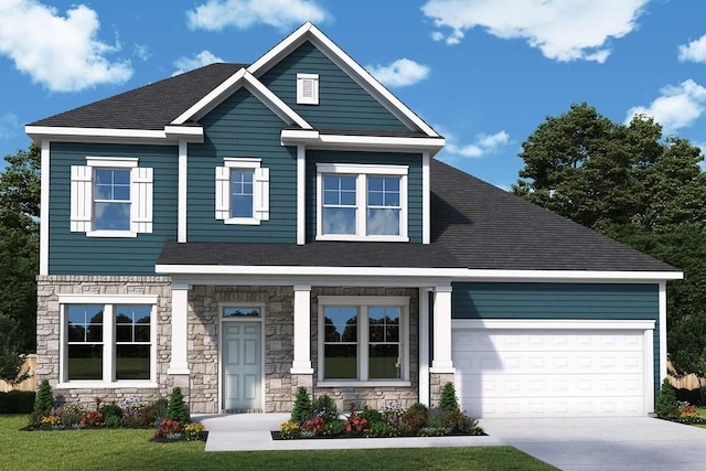 craftsman house featuring a front yard and a garage