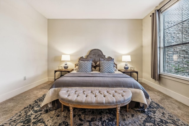 carpeted bedroom featuring multiple windows