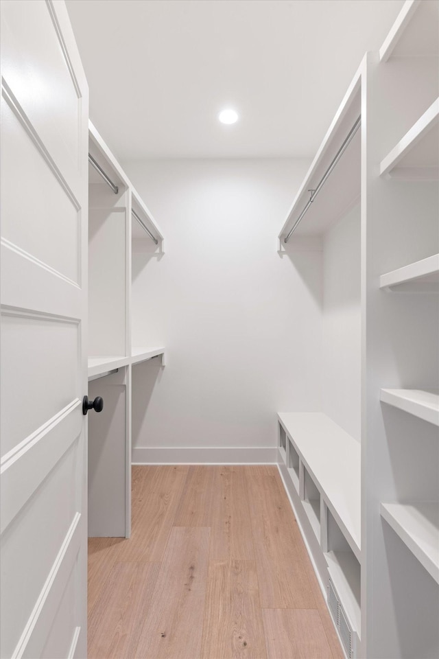 spacious closet with light wood-style flooring