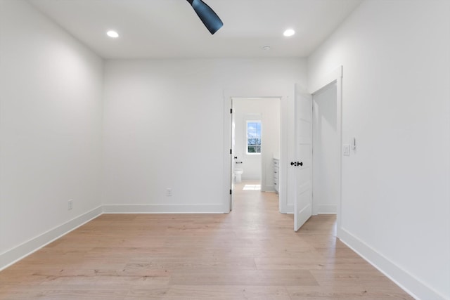 unfurnished room featuring recessed lighting, baseboards, and light wood-style floors