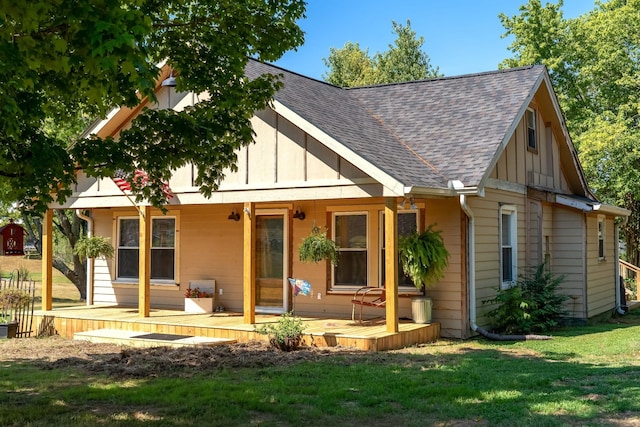 rear view of house with a yard