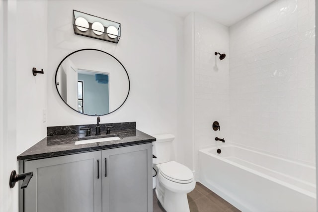 full bathroom featuring bathing tub / shower combination, tile patterned flooring, vanity, and toilet