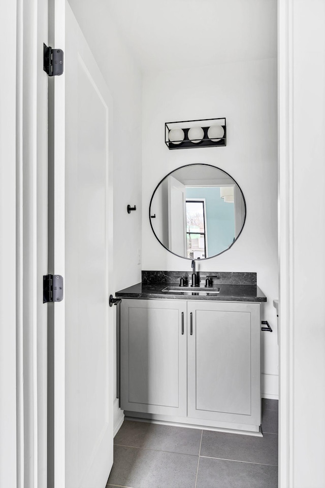 bathroom featuring tile patterned flooring and vanity