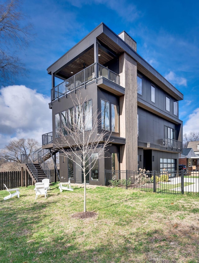 rear view of property featuring a yard