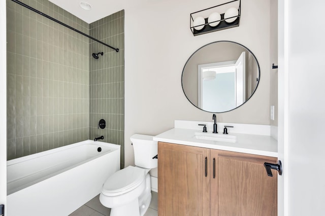 full bathroom featuring tile patterned floors, vanity, toilet, and tiled shower / bath combo