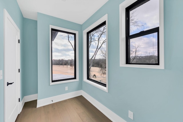 spare room featuring hardwood / wood-style flooring