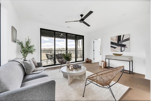 living room featuring floor to ceiling windows, ceiling fan, and hardwood / wood-style floors