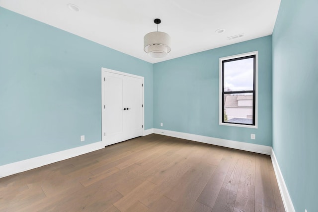 empty room featuring wood-type flooring