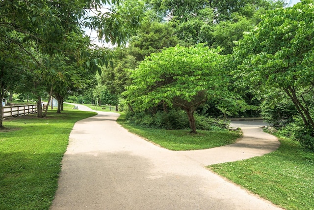 view of property's community with a lawn