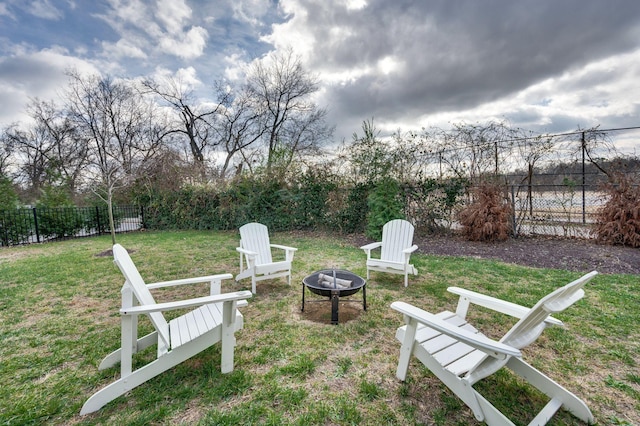 view of yard featuring an outdoor fire pit