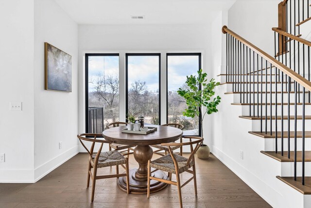 dining room with dark wood-type flooring