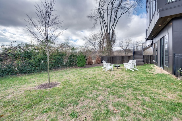 view of yard with a fire pit