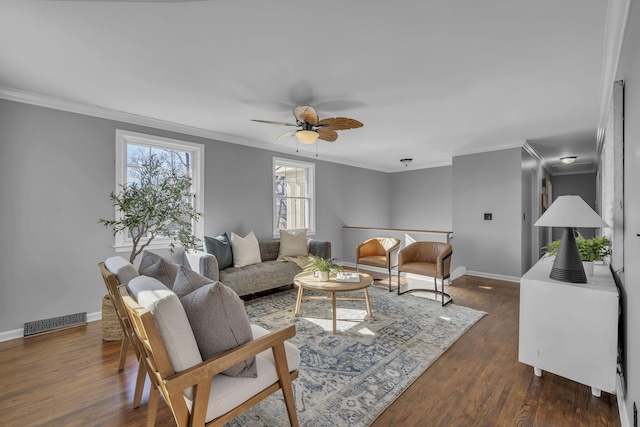 living room with ceiling fan, dark hardwood / wood-style flooring, and ornamental molding