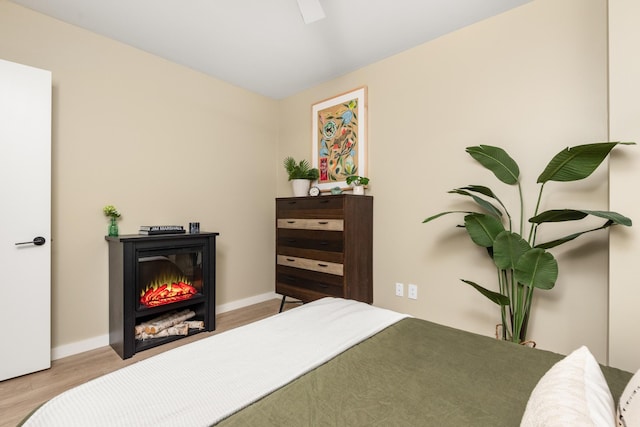 bedroom featuring ceiling fan and light wood-type flooring