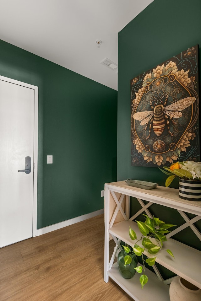 hallway with wood-type flooring