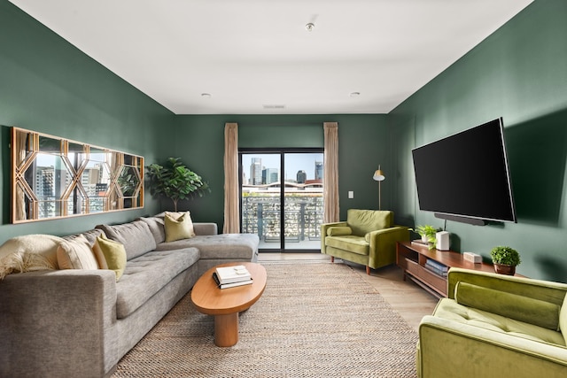 living room with light hardwood / wood-style flooring