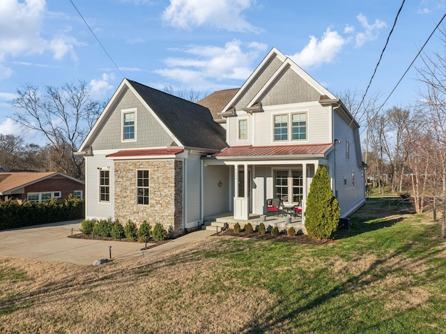 view of front facade with a porch and a front lawn