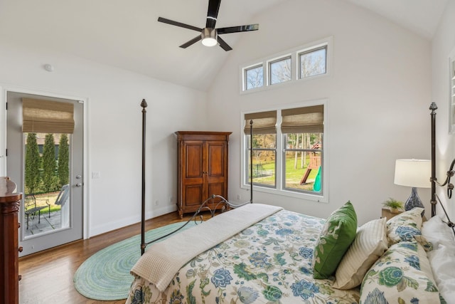 bedroom featuring access to outside, vaulted ceiling, ceiling fan, and light wood-type flooring