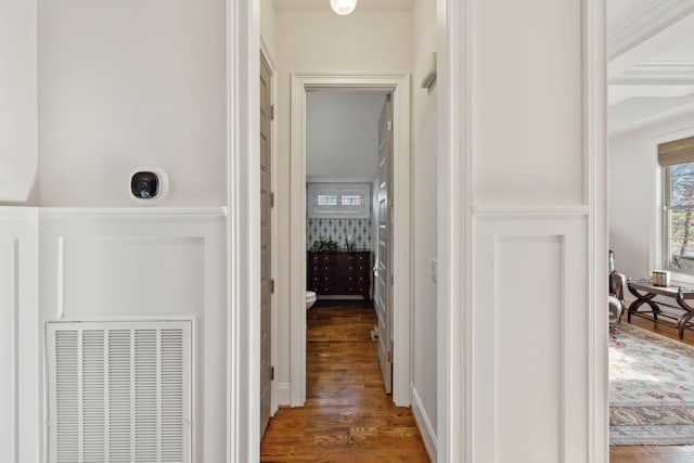 hallway with dark hardwood / wood-style floors