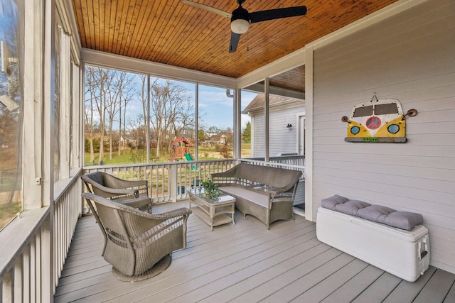 sunroom featuring wooden ceiling and ceiling fan