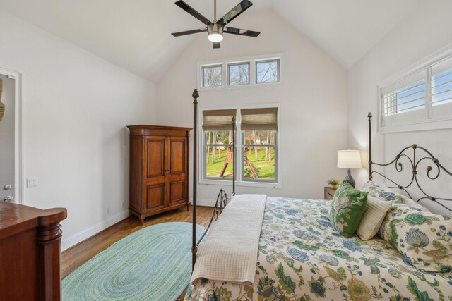 bedroom featuring wood-type flooring, lofted ceiling, and ceiling fan