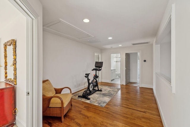 exercise area featuring hardwood / wood-style floors