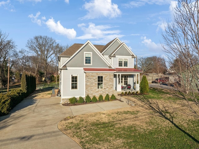 view of front of house featuring a front lawn and a porch