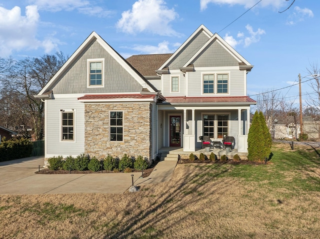 craftsman-style house with a front yard and a porch