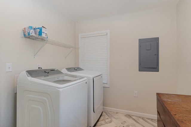 laundry area featuring marble finish floor, washing machine and clothes dryer, laundry area, electric panel, and baseboards