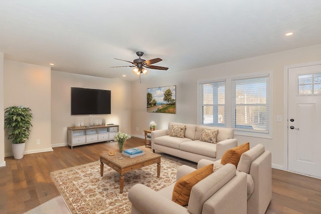 living room featuring recessed lighting, wood finished floors, a ceiling fan, and baseboards