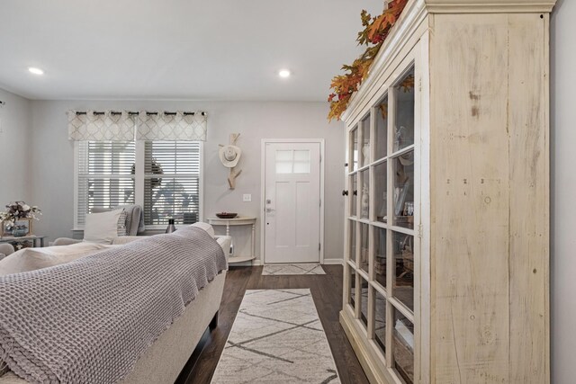 bedroom with dark wood-type flooring