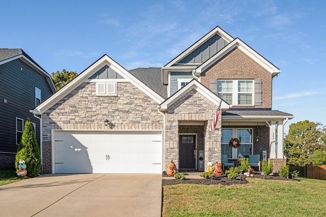 craftsman house featuring a garage and a front lawn