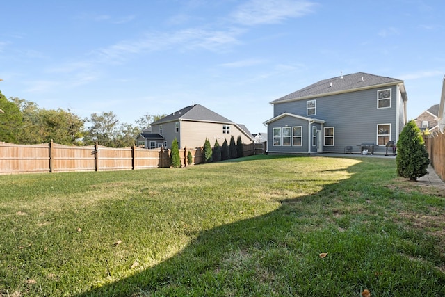 back of property with a lawn