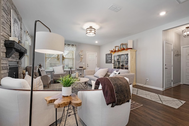 living room featuring dark hardwood / wood-style floors and a fireplace