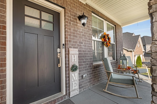 doorway to property featuring a porch