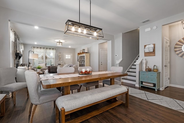 dining space with dark wood-type flooring