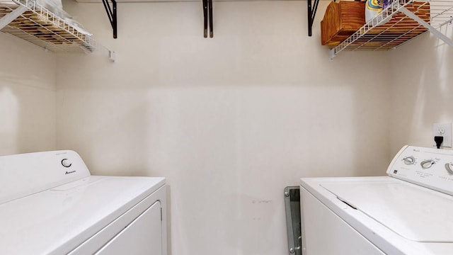 washroom featuring washer and dryer